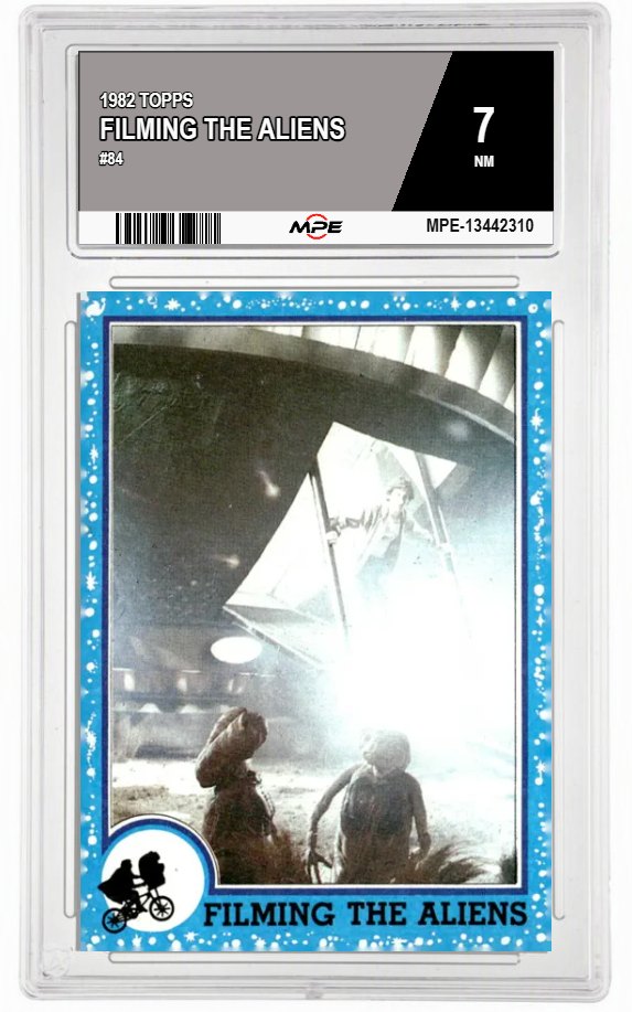 1982 TOPPS E.T. #84 FILMING THE ALIENS MPE 7 NM — graded card auctioned from the MPE vault